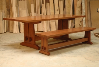 American-Cherry-Trestle-Table-with-cable-management-grommets-and-bench-angled-view