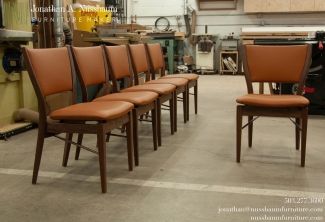 Six-Western-Walnut-and-Leather-Finn-Juhl-Inspired-Dining-Chairs-front