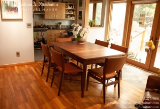 Western-Walnut-Table-and-Finn-Juhl-Inspired-Dining-Chairs-angle