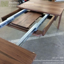 Western-Walnut-Finn-Juhl-inspired-extension-Table-self-storing-leaf